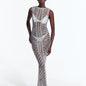 "Model wearing Luna Silver Crochet Dress from the front, highlighting the floor-length design and scoop neckline."