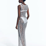 "Back view of Luna Silver Dress displaying intricate crochet pattern."