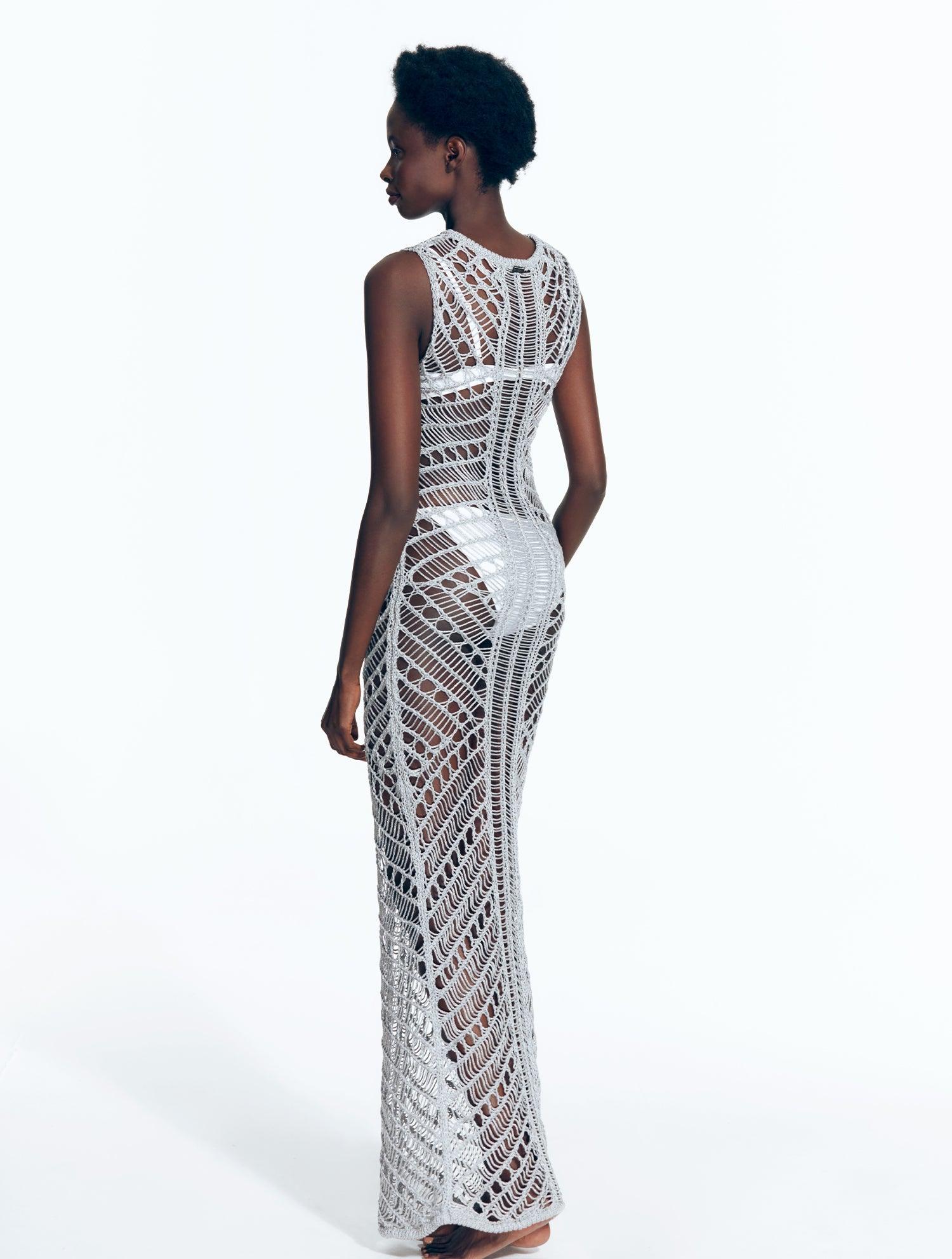 "Back view of Luna Silver Dress displaying intricate crochet pattern."