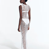 "Back view of Luna White Dress displaying intricate crochet pattern."