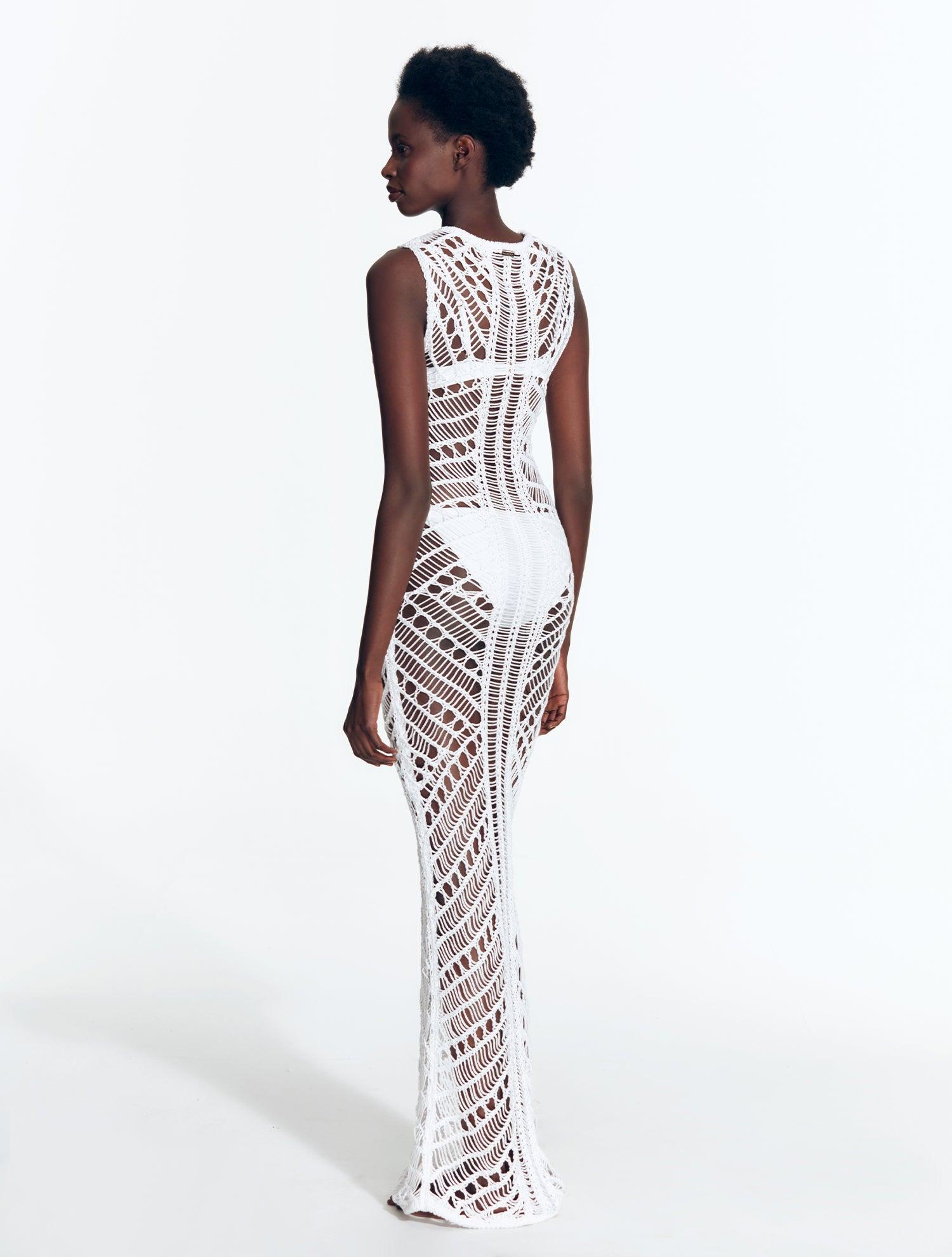 "Back view of Luna White Dress displaying intricate crochet pattern."