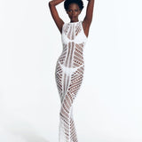 "Model wearing Luna White Crochet Dress  Rwith from front view floor-length design and scoop neckline."