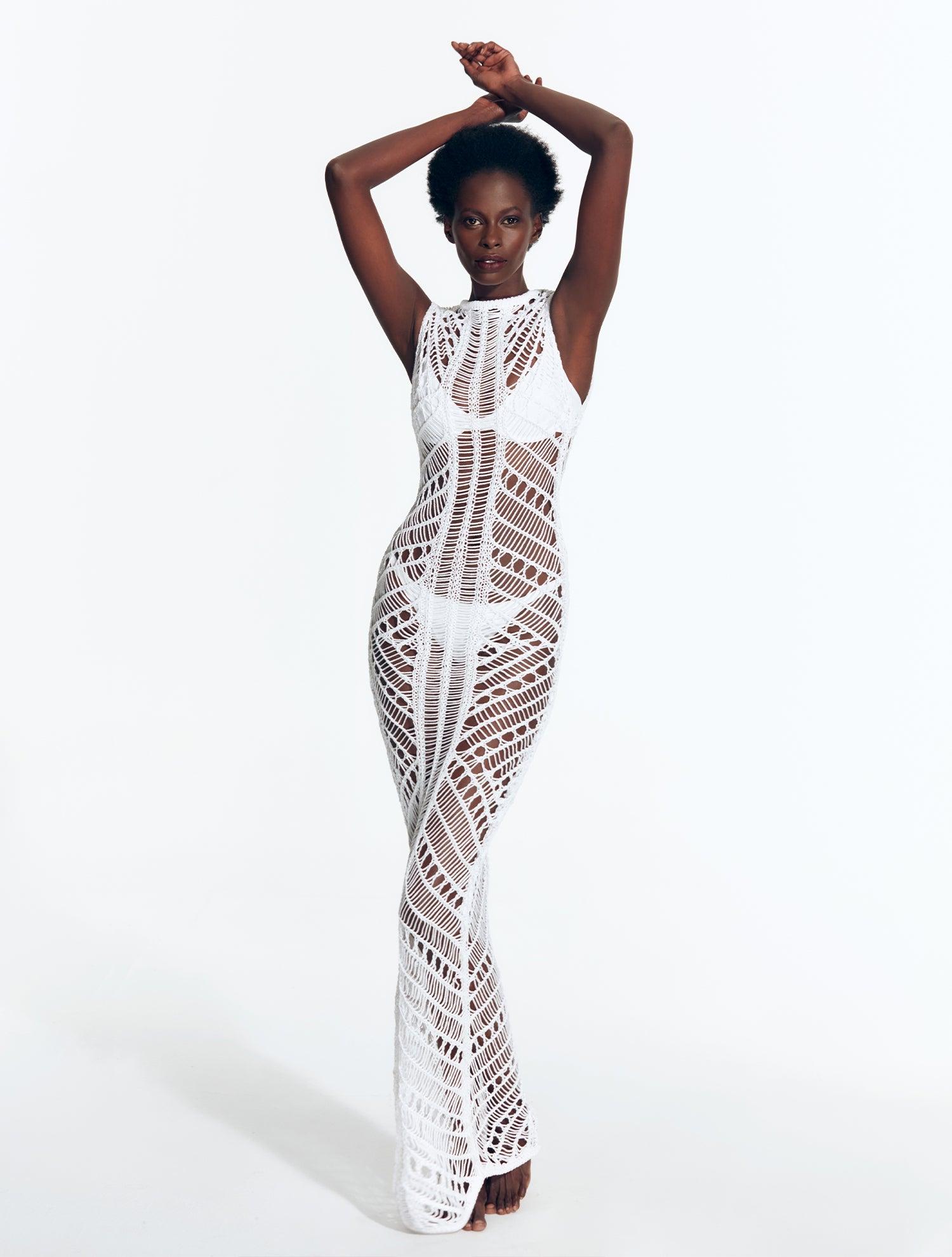 "Model wearing Luna White Crochet Dress  Rwith from front view floor-length design and scoop neckline."