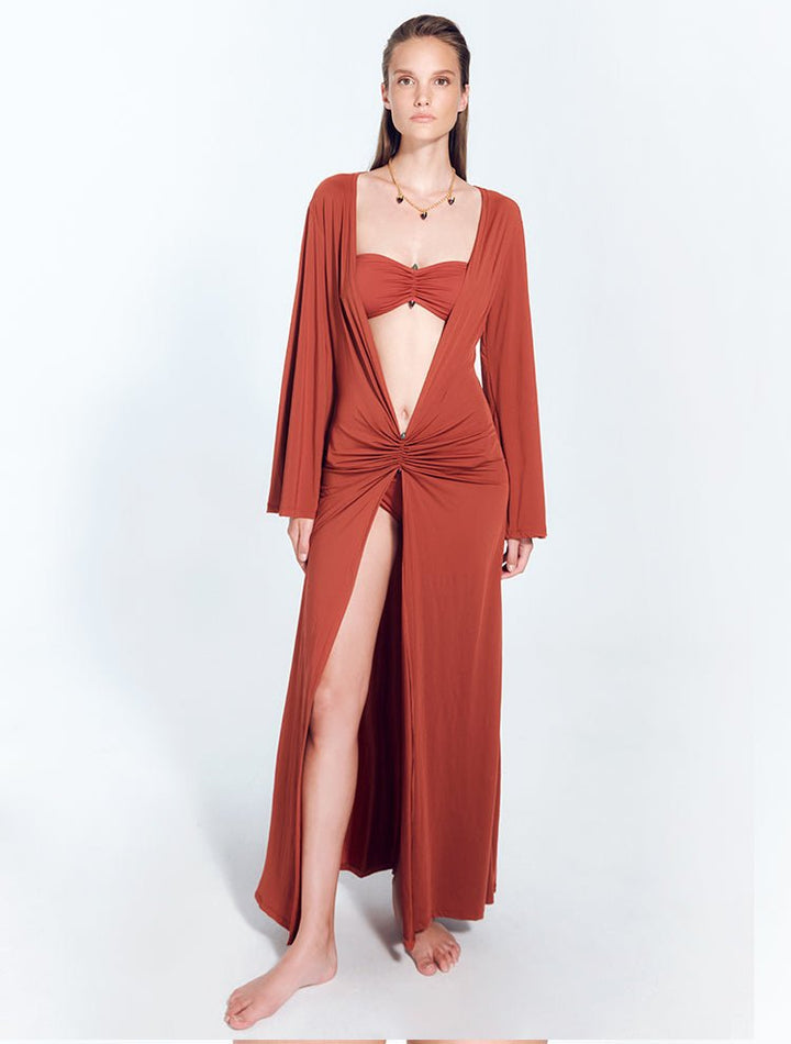 Front View: Model in Lupita Red Ochre Dress - Front Slit, Long Sleeved, Maxi Dress, Unlined, Day to Night, Soft Touch Fabric, MOEVA Luxury Swimwear
