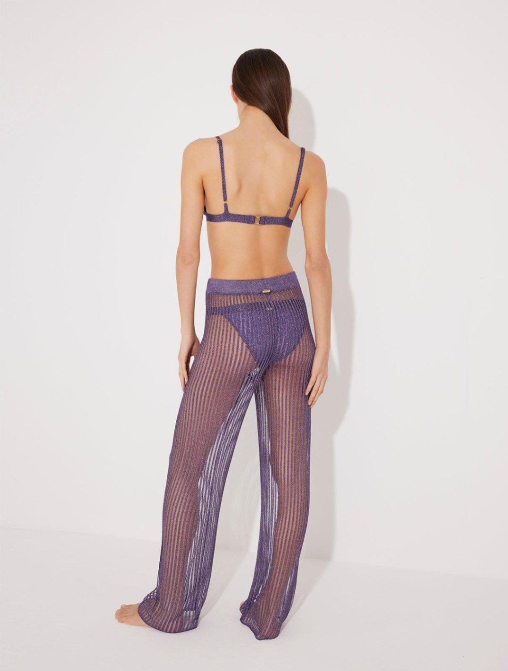 Back View: Model in Luz Lilac Pants - MOEVA Luxury Swimwear, Low Rise, Ankle Length,Comfort and Chic Beachwear, MOEVA Luxury Swimwear