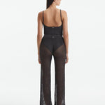Back View: Model in Luz Silver Pants - MOEVA Luxury Swimwear, Low Rise, Ankle Length,Comfort and Chic Beachwear, MOEVA Luxury Swimwear