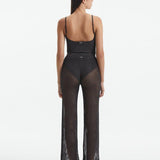 Back View: Model in Luz Silver Pants - MOEVA Luxury Swimwear, Low Rise, Ankle Length,Comfort and Chic Beachwear, MOEVA Luxury Swimwear