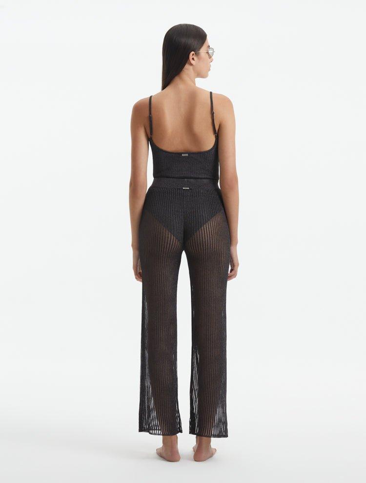 Back View: Model in Luz Silver Pants - MOEVA Luxury Swimwear, Low Rise, Ankle Length,Comfort and Chic Beachwear, MOEVA Luxury Swimwear