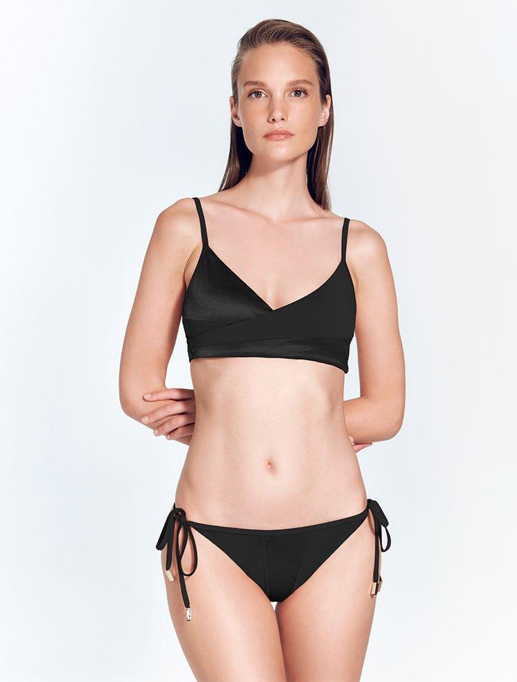 "Front view of the Maelys Black Bikini Bottom, showing the low-rise waist and contrast satin and matte fabric panels."