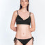 "Front view of the Maelys Black Bikini Bottom, showing the low-rise waist and contrast satin and matte fabric panels."