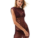 "Front view of Maggie Prune Dress on a model, showcasing the luxurious handmade crochet fabric and scoop neckline."