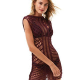 "Front view of Maggie Prune Dress on a model, showcasing the luxurious handmade crochet fabric and scoop neckline."