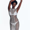 "Model wearing Maggie Silver Dress from the front view. The dress features a scoop neckline, body-firming crochet fabric, and mid-thigh length, showcasing a sleek and elegant silhouette."