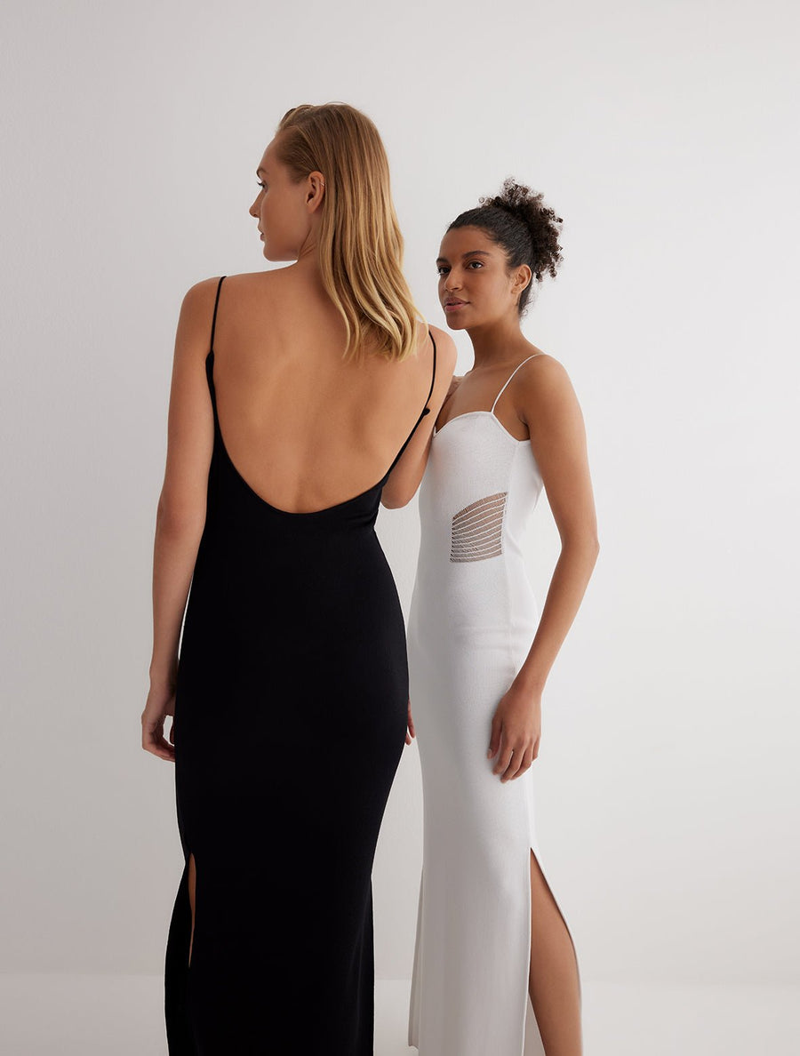 Back View: Model in Malin Black Dress - MOEVA Luxury Swimwear, Close Fit, 65% Viscose 35% Polyamide, MOEVA Luxury Swimwear