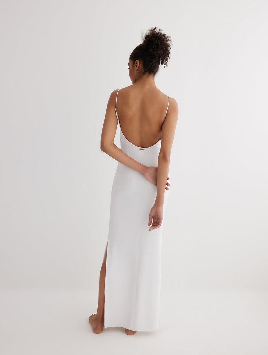 Back View: Model in Malin White Dress - MOEVA Luxury Swimwear, Semi-Sheer Panels, Ankle Length, MOEVA Luxury Swimwear