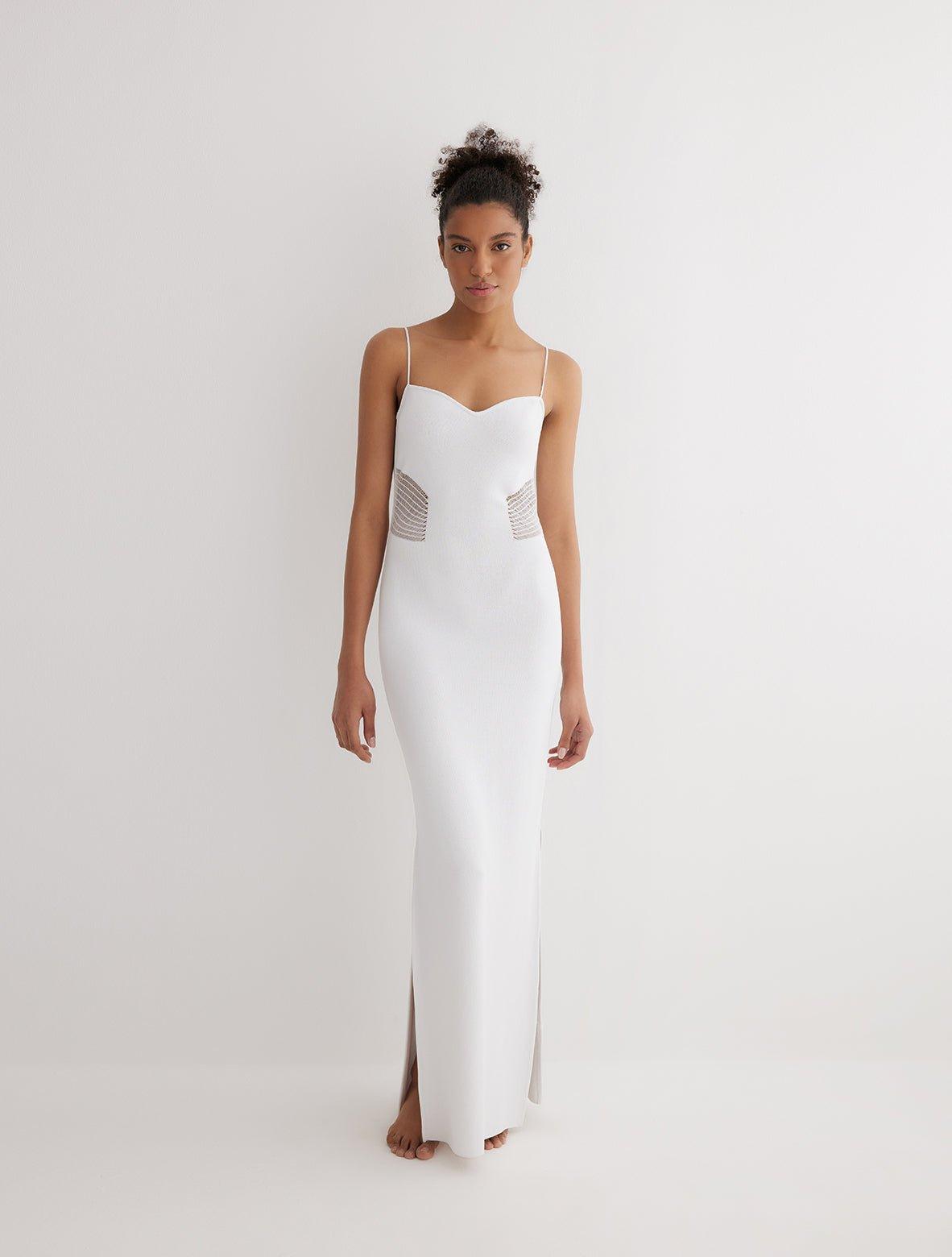 "Front view of the Malin white ankle-length dress showcasing the body-hugging fit, scoop neckline, and semi-sheer panels."