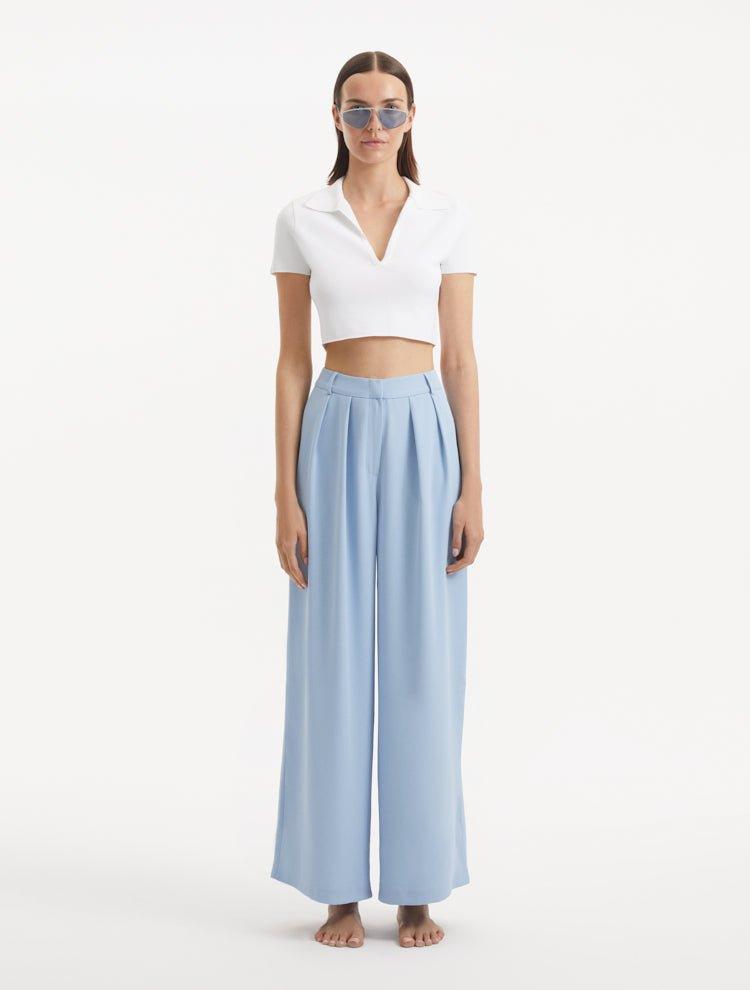 "Manami Baby Blue Pants from the front, highlighting the high waist design and wide-legged cut. "