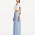"Side view of the Manami Baby Blue Pants, illustrating the wide-legged cut and the elegant flow of the fabric."