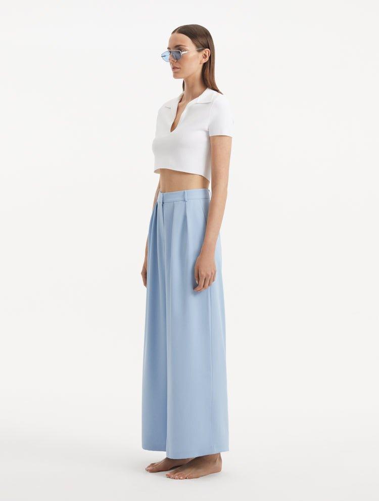 "Side view of the Manami Baby Blue Pants, illustrating the wide-legged cut and the elegant flow of the fabric."