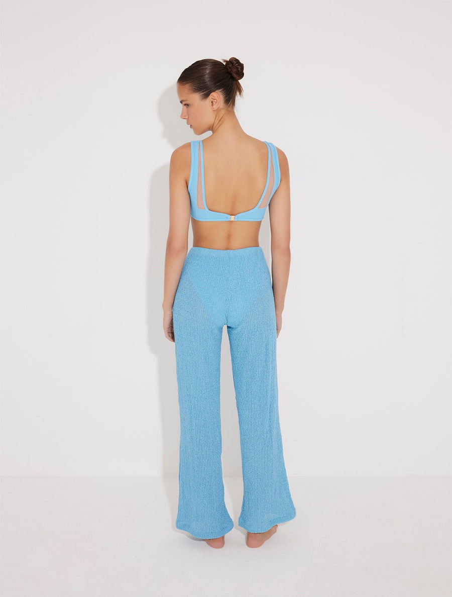Back View: Model in Manuela Blue Pants - MOEVA Luxury Swimwear, Unlined, Comfort, Accessorised, Recycle Fabric High Rise Beach Pants, MOEVA Luxury Swimwear