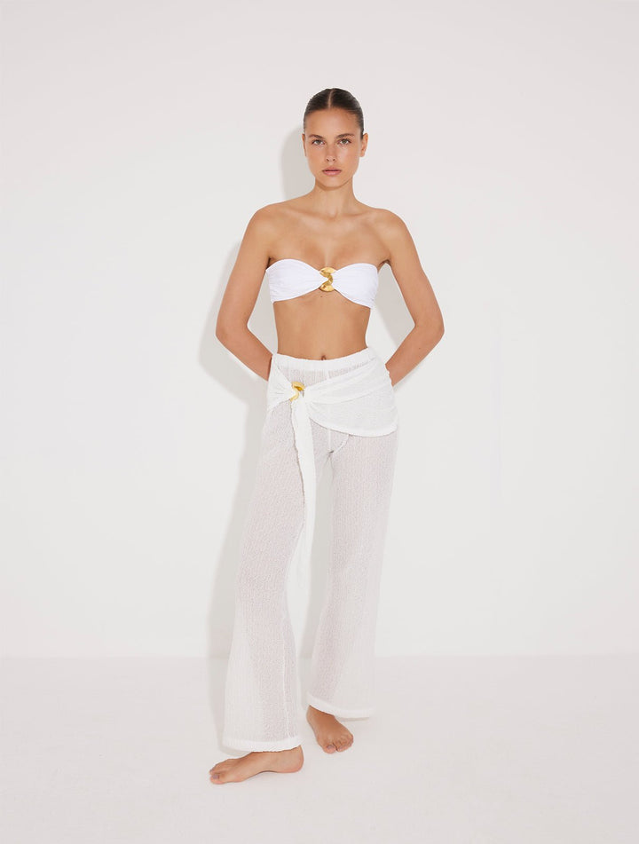 Front View: Model in Manuela White Pants - MOEVA Luxury Swimwear, High Rise, Layered With Panel, Gold Sculpted Hoop Accessory, Soft Recycle Fabric,  MOEVA Luxury Swimwear