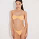 Front View: Model in Marcella Orange Bikini Top - Bandeau Style, Twisted Gold Accessory Detail, Ruched Detailing, Removable Padding and Straps, MOEVA Luxury Swimwear  