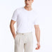 Front View of Model Wearing Marco Semigrey Shorts - MOEVA Luxury Swimwear, Straight-Leg Cut, Pleats at Front, Slip Pockets, MOEVA Luxury Swimwear