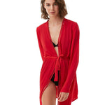 "Front view of the Margot Red Kaftan showing intricate embroidery along the front and a removable strappy belt."