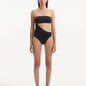 Model showcasing the Marilla Black Swimsuit, highlighting the high-waist style and strapless design with cut-out detail.