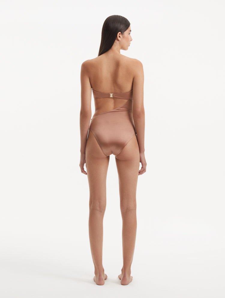 Back view of the Marilla Brown Swimsuit, emphasizing the gold clasps and overall fit.