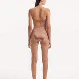 Back view of the Marilla Brown Swimsuit, emphasizing the gold clasps and overall fit.
