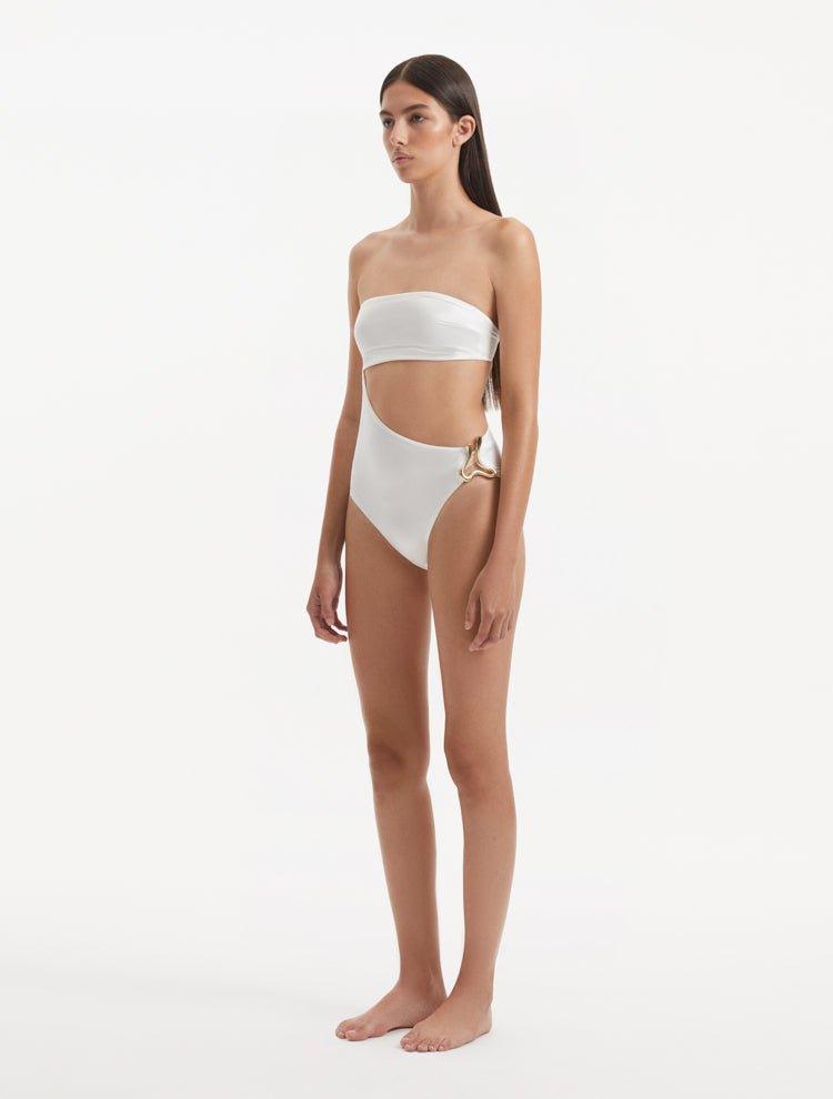  Side view of the Marilla White Swimsuit, showcasing the high-waist silhouette and strapless design.