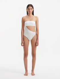 Model showcasing the Marilla White Swimsuit, highlighting the high-waist style and strapless design with cut-out detail.