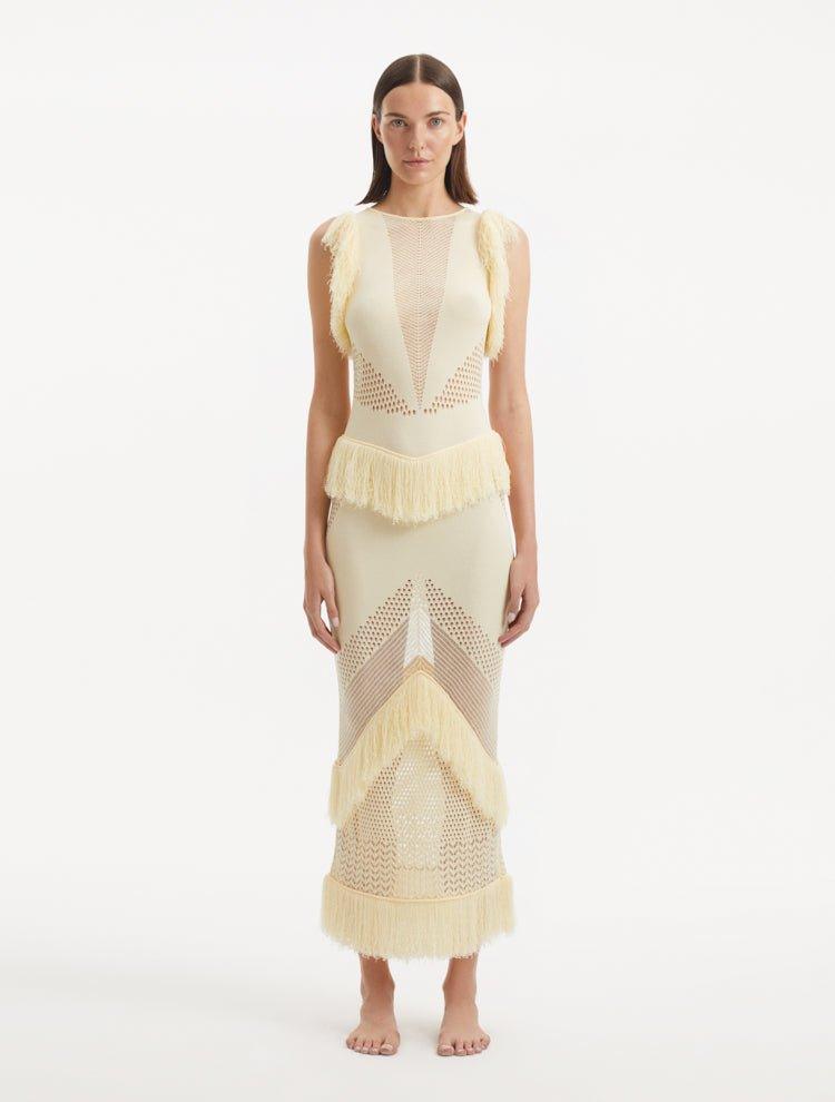 " Maris Yellow Dress from the front, showcasing the delicate mesh knit fabric, ankle-length silhouette, and the warm, golden hue. "