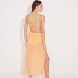 Back View: Model in Maritza Orange Skirt - MOEVA Luxury Swimwear, Maxi Skirt, Unlined,Chic, Accessorised, Soft Touch Fabric, High Rise Ankle Length Beachwear, MOEVA Luxury Swimwear