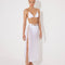 Front View: Model in Maritza White Skirt - MOEVA Luxury Swimwear, Side Slit, High Rise, Elastic Waistband, Geometrical Chain Belt, MOEVA Luxury Swimwear