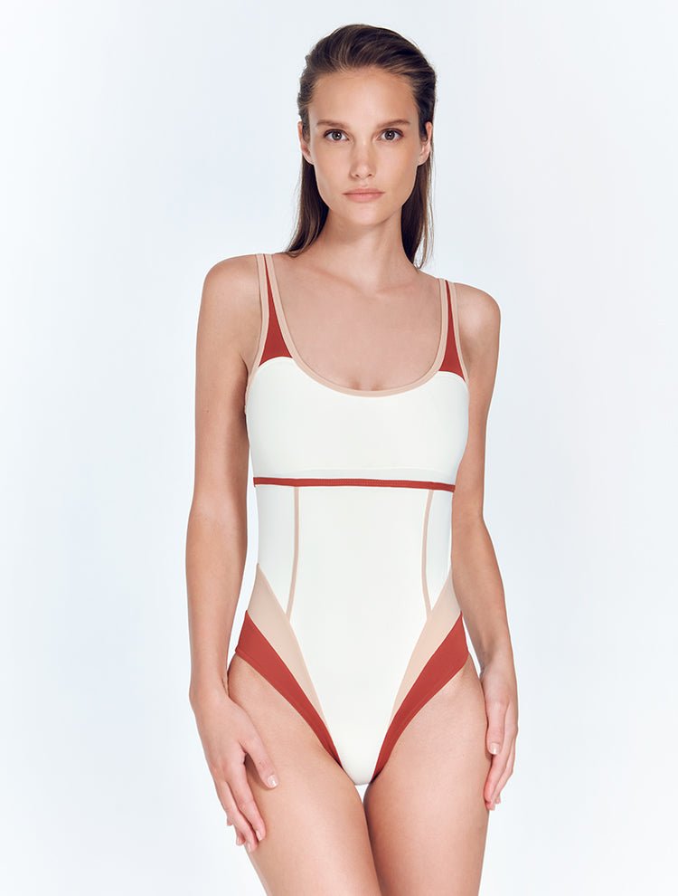 Front View: Model in Martina Red Ochre/Nude/White Swimsuit - MOEVA Luxury Swimwear, Geometrical Design, Scoop Neckline, Comfort and Sportive, High-Cut Leg, MOEVA Luxury Swimwear