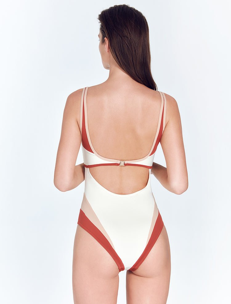 Back View: Model in Martina Red Ochre/Nude/White Swimsuit - MOEVA Luxury Swimwear, Gold Clasps at the Back, Moderate Bottom Coverage, Lycra XtraLife® Certificate, Italian Fabric, One Piece Swimwear, MOEVA Luxury Swimwear