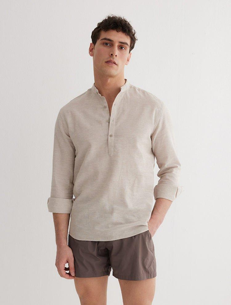 Front View: Model in Matteo Khaki Shirt - MOEVA Luxury Swimwear, Spread Collar, Buttoned Cuffs, Half-Plaket, Button Fastening, Tailored Italian Linen, Long-Sleeved, Regular Fit, MOEVA Luxury Swimwear