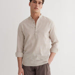 Front View: Model in Matteo Khaki Shirt - MOEVA Luxury Swimwear, Spread Collar, Buttoned Cuffs, Half-Plaket, Button Fastening, Tailored Italian Linen, Long-Sleeved, Regular Fit, MOEVA Luxury Swimwear