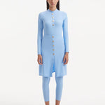 Model wearing the Meissa Baby Blue Burkini, highlighting the soft pastel color and full coverage design.