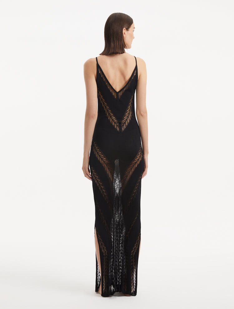 Back View: Model in Mimi Black Dress - MOEVA Luxury Swimwear, Knitted Maxi Dress, Comfortable Fit, Unlined, Day to Night and Signature, Slit Details, Close Fit, MOEVA Luxury Swimwear