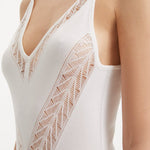 Close up: Model Wearing Mimi White Dress - Elegance in White, Mesh Knit Fabric, Contemporary Beachwear, MOEVA Luxury Swimwear