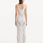 Back View: Model in Mimi White Dress - MOEVA Luxury Swimwear, Slit Details, Close Fit, MOEVA Luxury Swimwear