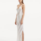 Side View: Model in Mimi White Dress - Knitted Maxi Dress, Comfortable Fit, Unlined, Day to Night and Signature, Luxurious Beachwear, MOEVA Luxury Swimwear