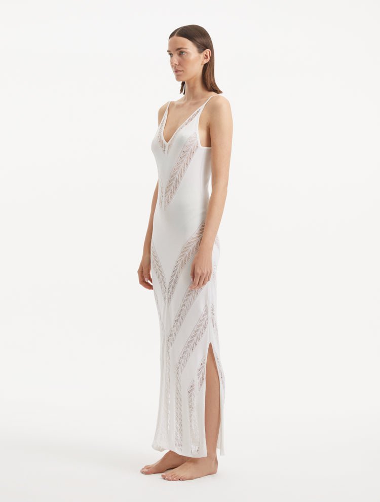 Side View: Model in Mimi White Dress - Knitted Maxi Dress, Comfortable Fit, Unlined, Day to Night and Signature, Luxurious Beachwear, MOEVA Luxury Swimwear