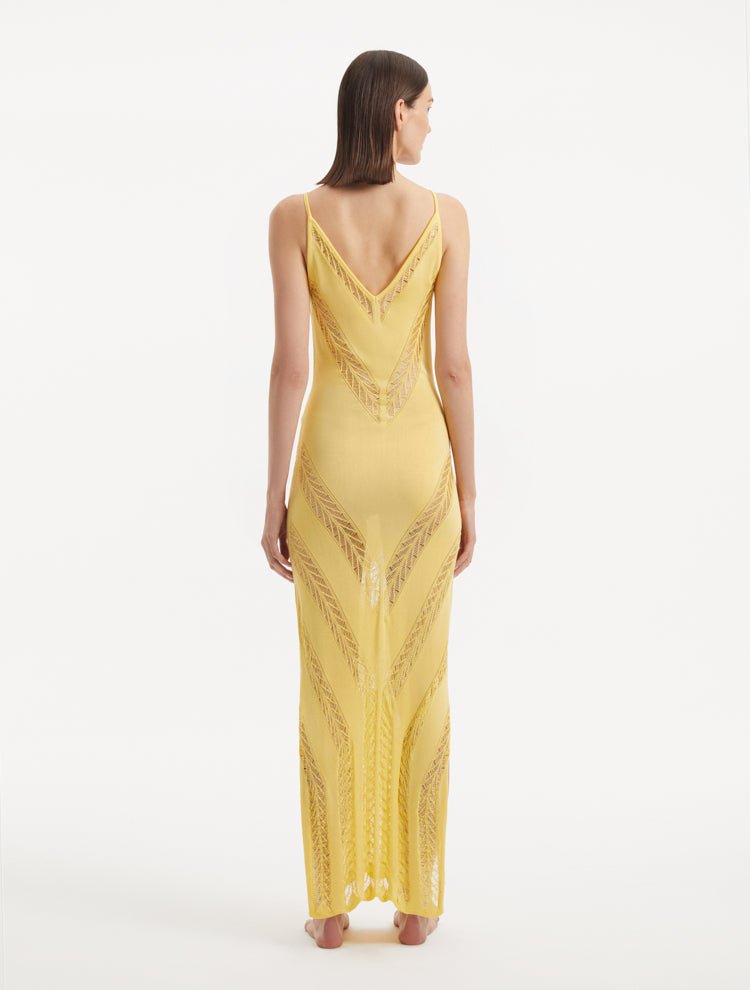 Back View: Model in Mimi Yellow Dress - MOEVA Luxury Swimwear, Knitted Maxi Dress, Comfortable Fit, Unlined, Day to Night and Signature, Slit Details, Close Fit, MOEVA Luxury Swimwear