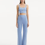 "Model wearing the Moira Baby Blue Pants from the front, showcasing the high-waisted design and wide-leg silhouette. "