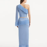 "Model wearing the Monroe Baby Blue Top and Alani Skirt from the back, showcasing the clean lines and cropped design. "
