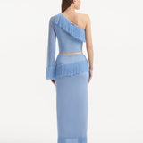 "Model wearing the Monroe Baby Blue Top and Alani Skirt from the back, showcasing the clean lines and cropped design. "